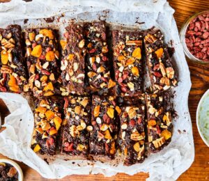 Healthy Rocky Road with dried apricots, pecans, almonds, goji berries, black beans, and cocoa powder