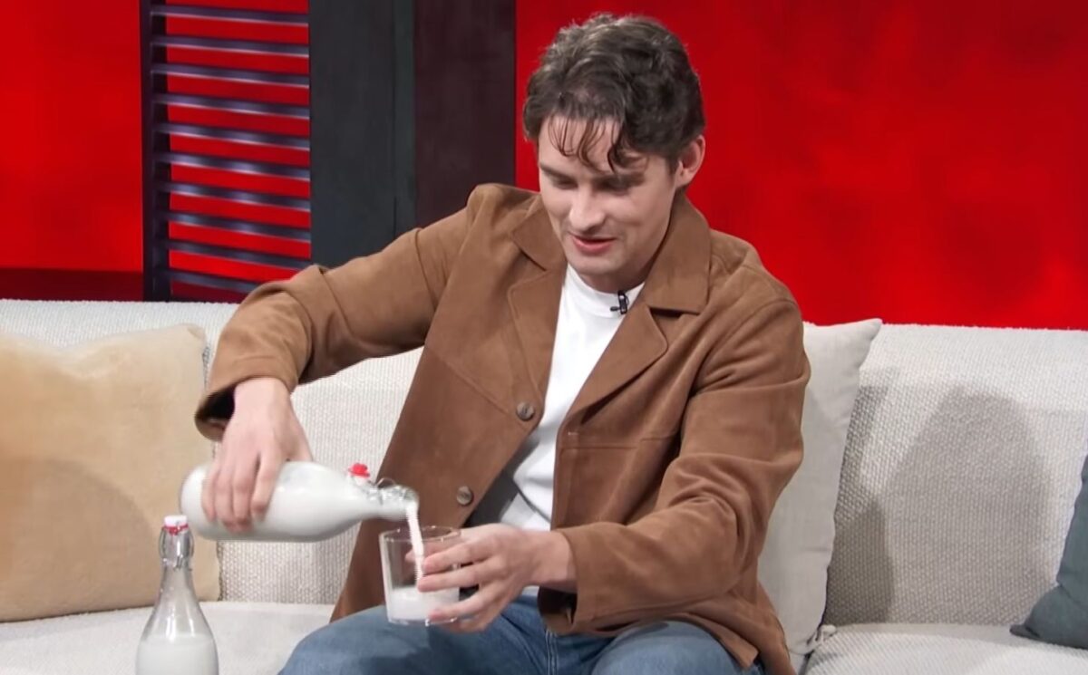 Photo shows 'Obsession' actor Michael Johnston during a recent appearance on 'Access Hollywood,' pouring a glass of plant-based almond milk that he made himself