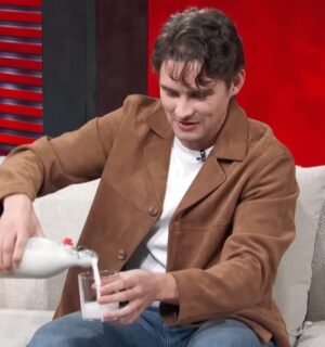 Photo shows 'Obsession' actor Michael Johnston during a recent appearance on 'Access Hollywood,' pouring a glass of plant-based almond milk that he made himself