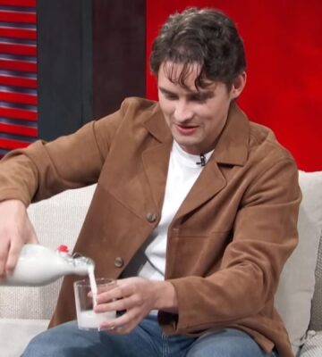Photo shows 'Obsession' actor Michael Johnston during a recent appearance on 'Access Hollywood,' pouring a glass of plant-based almond milk that he made himself