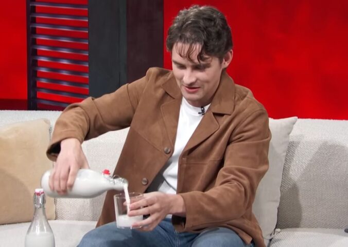Photo shows 'Obsession' actor Michael Johnston during a recent appearance on 'Access Hollywood,' pouring a glass of plant-based almond milk that he made himself