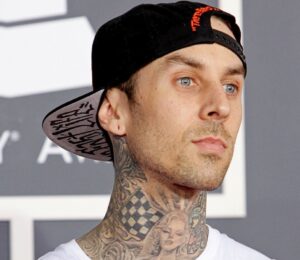 Photo shows Travis Barker at an event. Vegan fast-food brand Mr Charlie’s is opening a new store this weekend and Travis Barker is expected to make a “special appearance.”