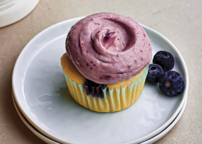 Zesty Blueberry Cupcakes with juicy blueberries, tangy cream cheese frosting, and citrus