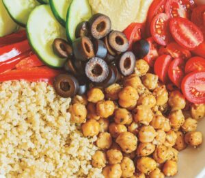 Mediterranean Power Bowls with quinoa, cucumber, olives, hummus, and bell pepper