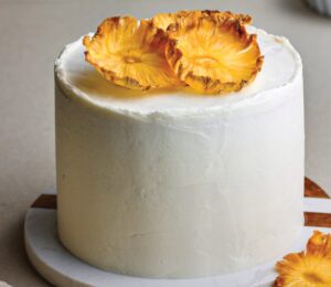 Coconut & Pineapple Layer Cake with pineapple slices, cinnamon, coconut milk, and vanilla for vegan birthday cake ideas