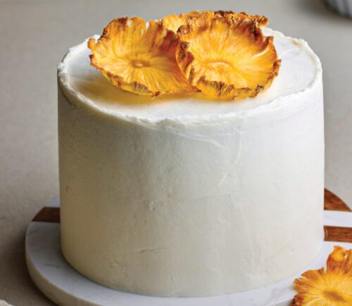 Coconut & Pineapple Layer Cake with pineapple slices, cinnamon, coconut milk, and vanilla for vegan birthday cake ideas