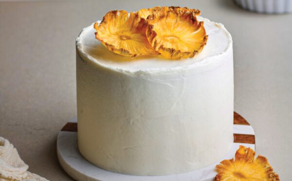 Coconut & Pineapple Layer Cake with pineapple slices, cinnamon, coconut milk, and vanilla for vegan birthday cake ideas