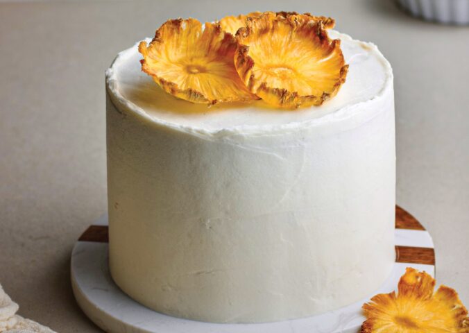 Coconut & Pineapple Layer Cake with pineapple slices, cinnamon, coconut milk, and vanilla for vegan birthday cake ideas