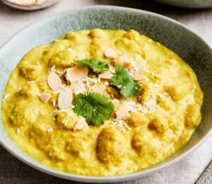 chickpeas and cannellini beans cooked in a coconut milk, carrot, and almond sauce for vegan coconut recipes