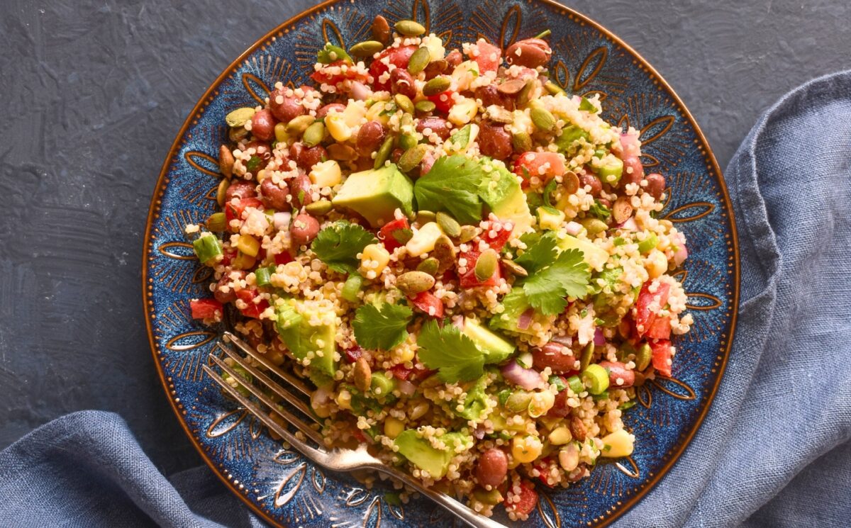 Kaleidoscopic Quinoa Salad with peppers, avocado, roasted seeds, beans and more