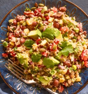 Kaleidoscopic Quinoa Salad with peppers, avocado, roasted seeds, beans and more