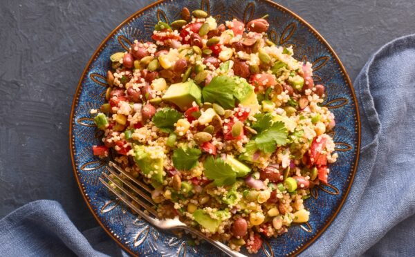 Kaleidoscopic Quinoa Salad with peppers, avocado, roasted seeds, beans and more