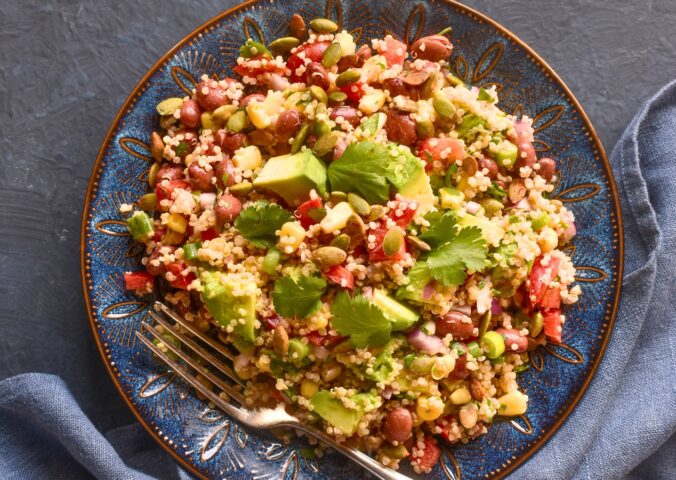 Kaleidoscopic Quinoa Salad with peppers, avocado, roasted seeds, beans and more