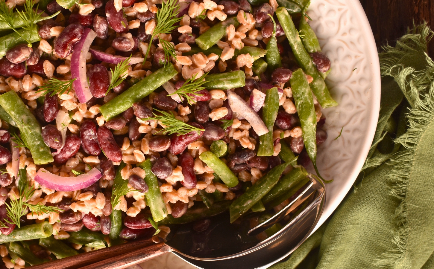 Lemony Farro And Bean Salad with kidney, black, and green beans with a Dijon dressing
