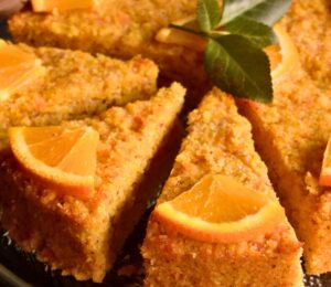 Orange-Ginger Polenta Cake with applesauce, maple syrup, vegan whipped cream and almond flour