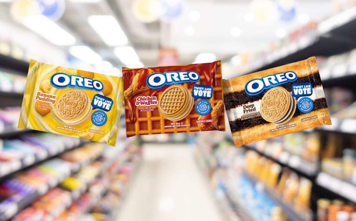 Photo shows the packaging of the three new flavors of Oreo cookies against a stock supermarket image background. The Oreo flavors include Banana Pudding (left), Chicken And Waffles (center), and Deep Fried (right).