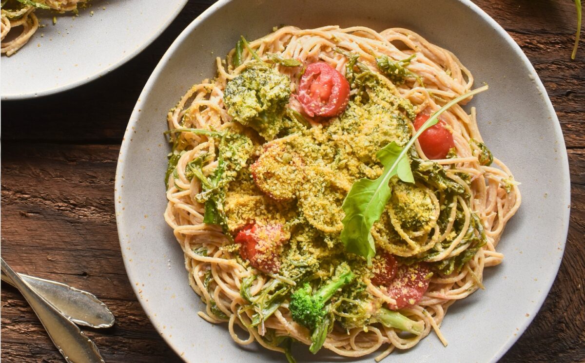 Pasta With Arugula In A Creamy Lemon Sauce with cashews, whole-grain pasta, broccoli, tomato, and vegan parm