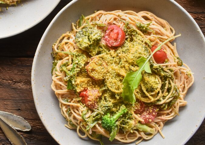 Pasta With Arugula In A Creamy Lemon Sauce with cashews, whole-grain pasta, broccoli, tomato, and vegan parm