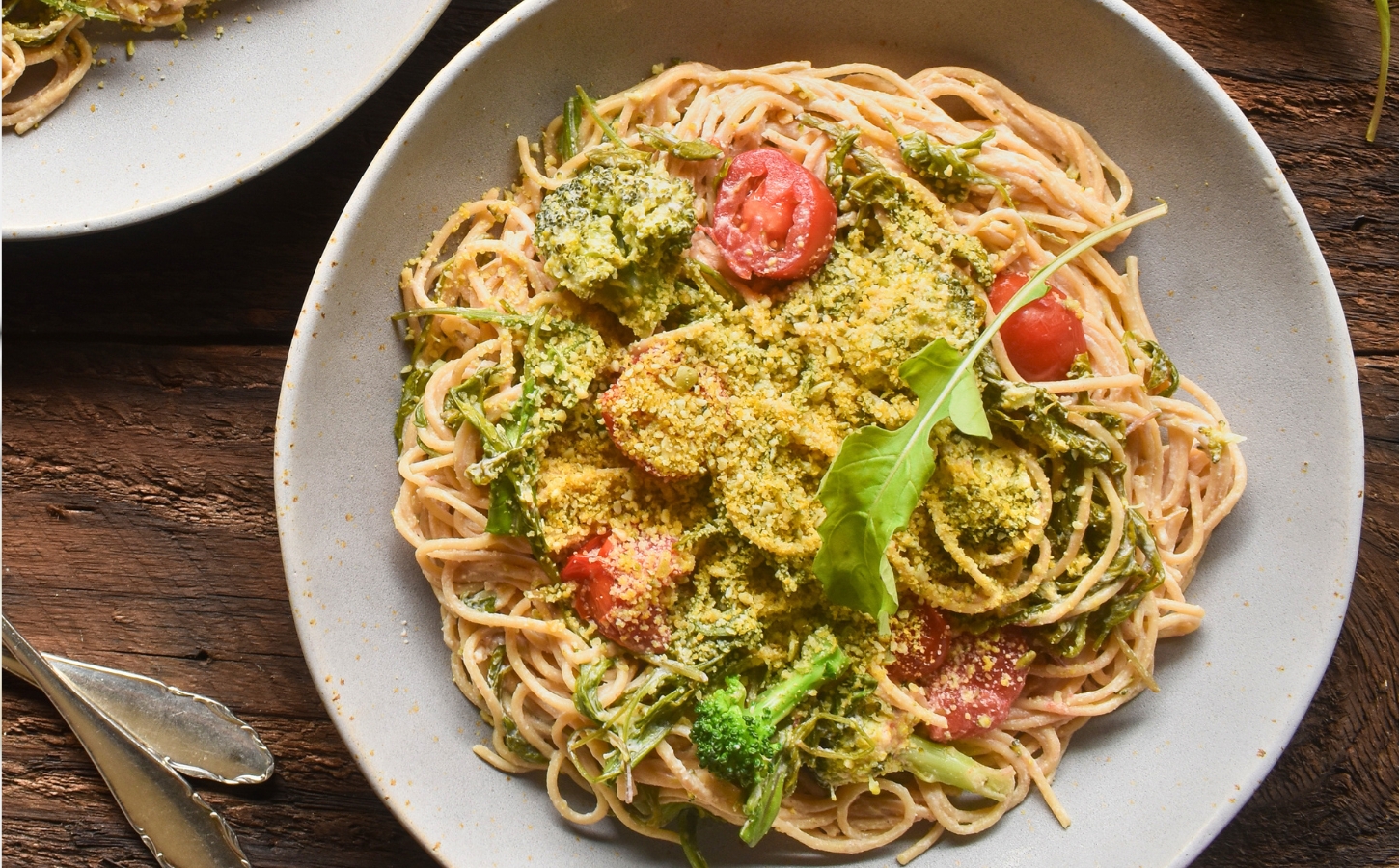 Pasta With Arugula In A Creamy Lemon Sauce with cashews, whole-grain pasta, broccoli, tomato, and vegan parm