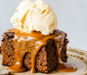vegan sticky date cake with toffee and vanilla ice cream for vegan recipes that use dates