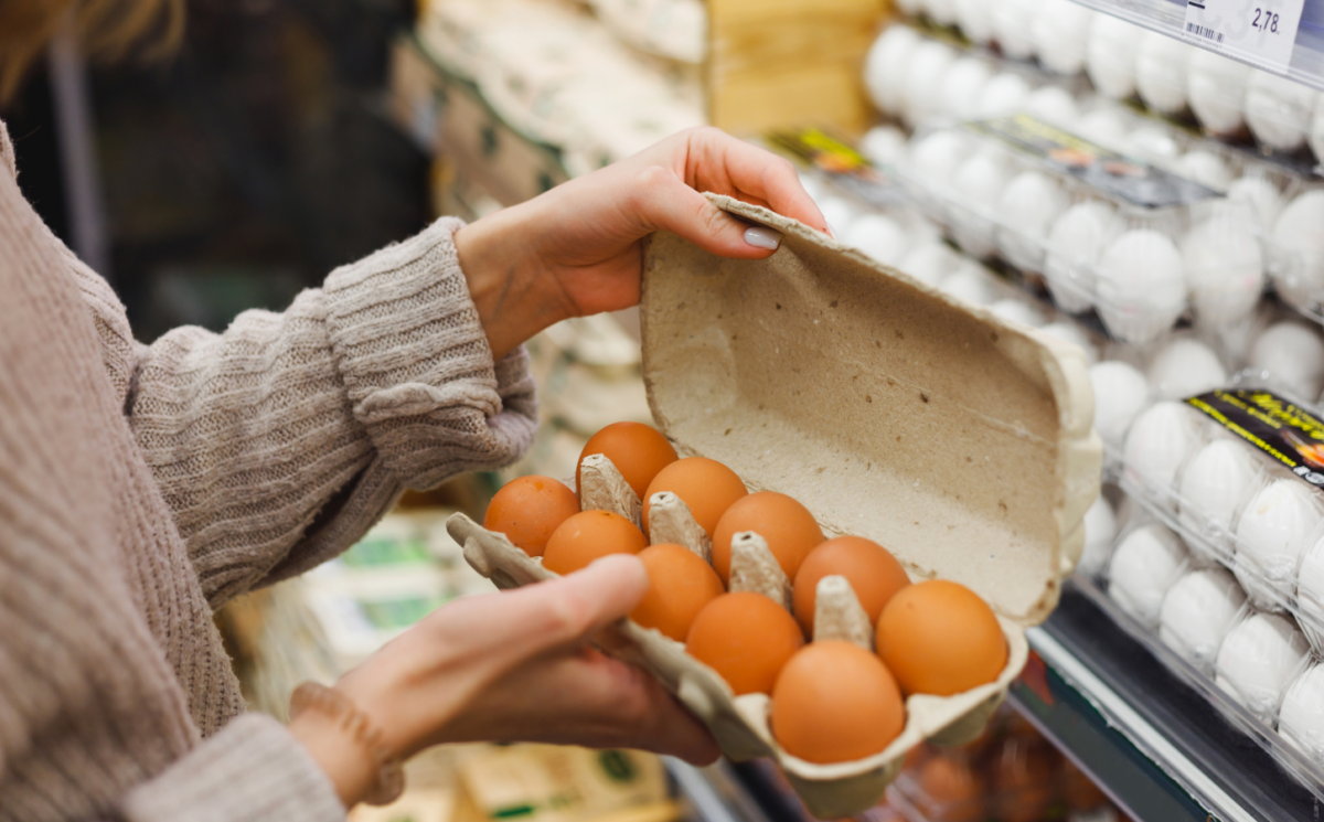 Photo shows a woman holding a carton of eggs in a supermarket. The UK Health Security Agency (UKHSA) has declared a national salmonella outbreak after one person died and hundreds became ill