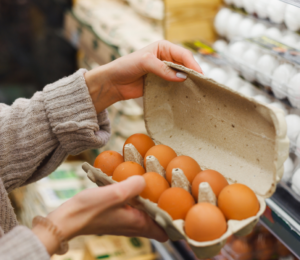 Photo shows a woman holding a carton of eggs in a supermarket. The UK Health Security Agency (UKHSA) has declared a national salmonella outbreak after one person died and hundreds became ill