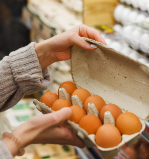 Photo shows a woman holding a carton of eggs in a supermarket. The UK Health Security Agency (UKHSA) has declared a national salmonella outbreak after one person died and hundreds became ill