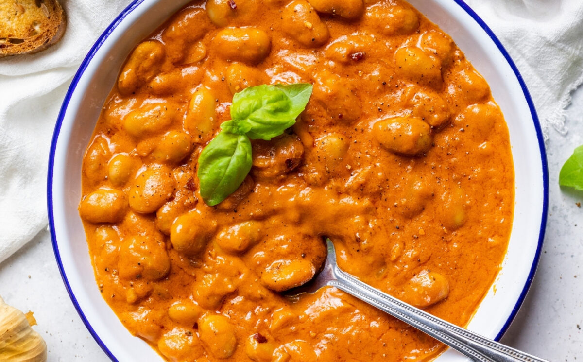 A close-up of beans alla vodka, a plant-based and high protein take on penne alla vodka for 7 Creamy Vegan Tomato Recipes