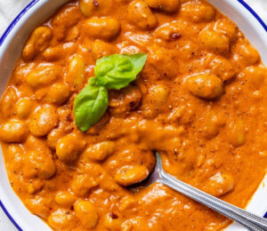 A close-up of beans alla vodka, a plant-based and high protein take on penne alla vodka for 7 Creamy Vegan Tomato Recipes