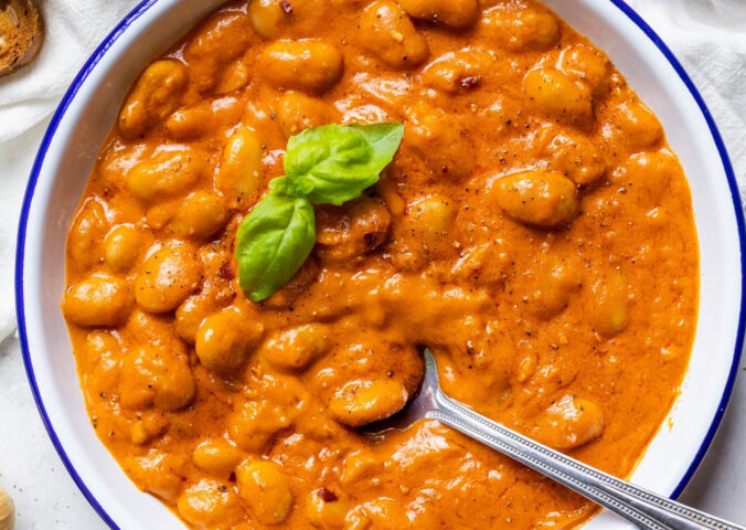 A close-up of beans alla vodka, a plant-based and high protein take on penne alla vodka for 7 Creamy Vegan Tomato Recipes