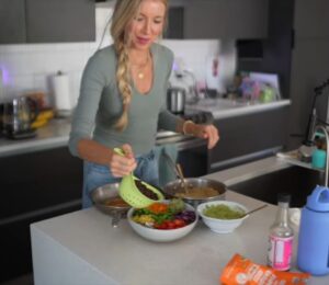 Stanczyk stands behind her kitchen counter preparing lunch as part of her plant-based high-protein diet.