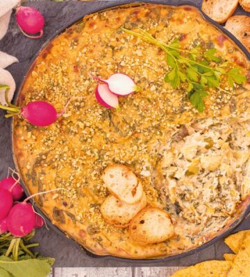 Baked Spinach And Artichoke Dip with tofu, garlic, vegan cream cheese, and brazil nut parm