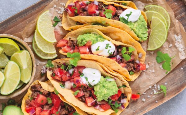 black bean and walnut tacos with salsa, avocado, lime, and sour cream