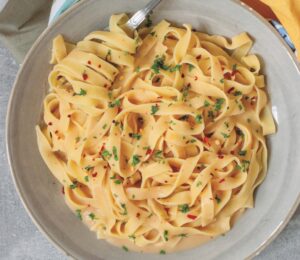 Creamy Cannellini Fettuccine Alfredo with nutritional yeast, onion, and lemon