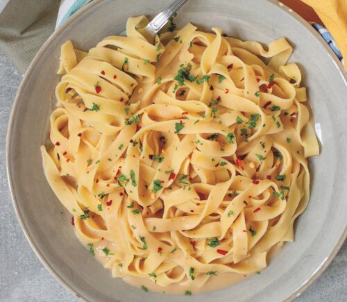 Creamy Cannellini Fettuccine Alfredo with nutritional yeast, onion, and lemon
