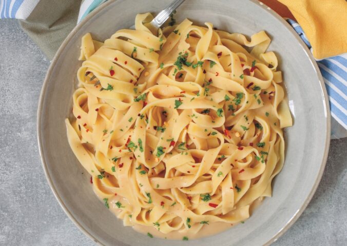 Creamy Cannellini Fettuccine Alfredo with nutritional yeast, onion, and lemon