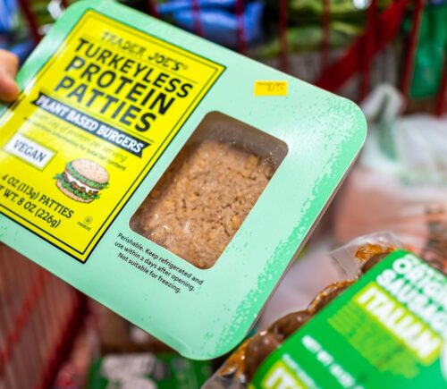 Photo shows someone's hand as they hold a pack of "Turkeyless Protein Patties" from Trader Joe's. Several members of the European Parliament (MEPs) have sought to expand the EU plant-based label ban to include more words
