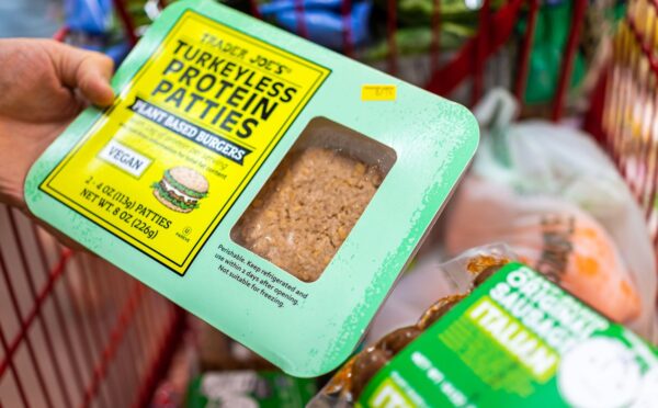 Photo shows someone's hand as they hold a pack of "Turkeyless Protein Patties" from Trader Joe's. Several members of the European Parliament (MEPs) have sought to expand the EU plant-based label ban to include more words