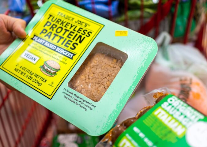 Photo shows someone's hand as they hold a pack of "Turkeyless Protein Patties" from Trader Joe's. Several members of the European Parliament (MEPs) have sought to expand the EU plant-based label ban to include more words