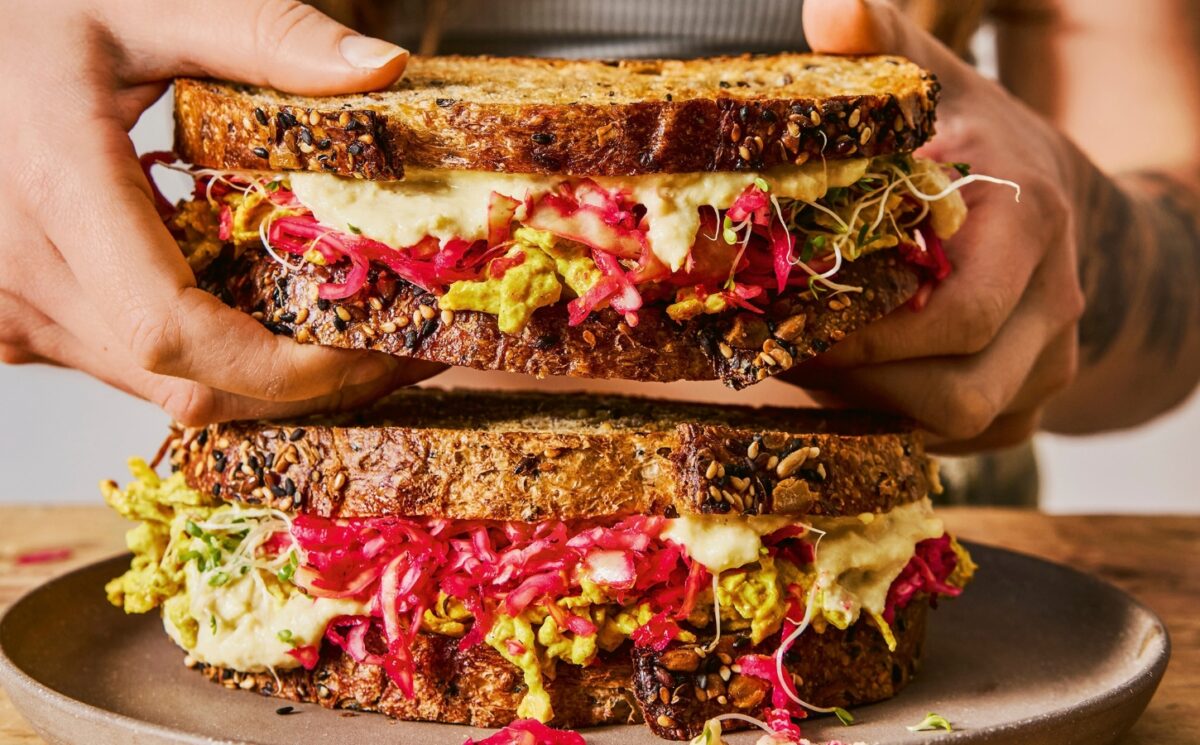 gut-loving sourdough sandwich with pink sauerkraut, hummus, and tofu