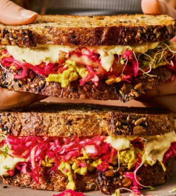 gut-loving sourdough sandwich with pink sauerkraut, hummus, and tofu