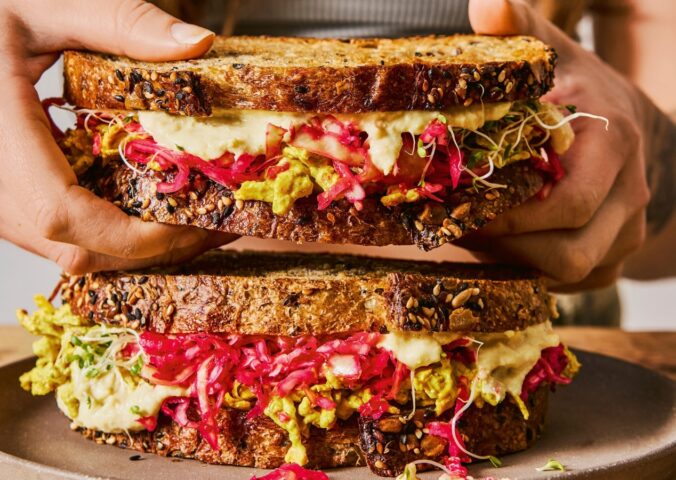 gut-loving sourdough sandwich with pink sauerkraut, hummus, and tofu