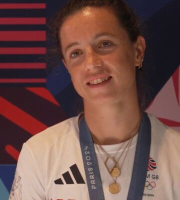 Photo shows Imogen Grant being interviewed by Lottery Good Causes with her Paris 2024 teammate Emily Craig. The pair won gold in the lightweight women's double sculls at the last Olympics. Imogen Grant is currently training for LA 2028 on a vegan diet