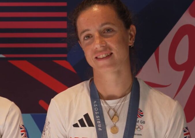 Photo shows Imogen Grant being interviewed by Lottery Good Causes with her Paris 2024 teammate Emily Craig. The pair won gold in the lightweight women's double sculls at the last Olympics. Imogen Grant is currently training for LA 2028 on a vegan diet