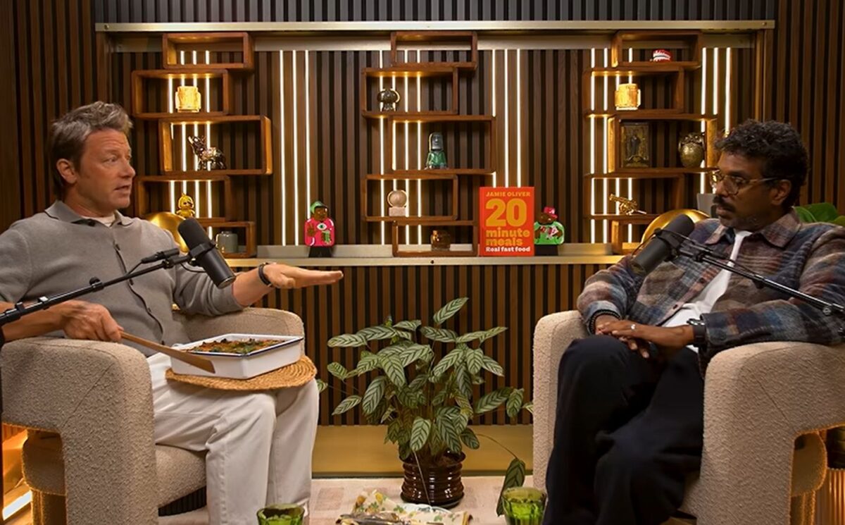 Photo shows Jamie Oliver speaking to Romesh Ranganathan on a recent episode of his podcast, and the celebrity chef brought the comedian a vegan lasagna