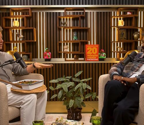 Photo shows Jamie Oliver speaking to Romesh Ranganathan on a recent episode of his podcast, and the celebrity chef brought the comedian a vegan lasagna
