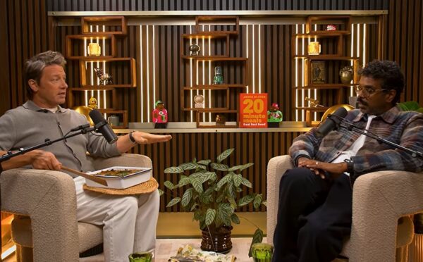 Photo shows Jamie Oliver speaking to Romesh Ranganathan on a recent episode of his podcast, and the celebrity chef brought the comedian a vegan lasagna