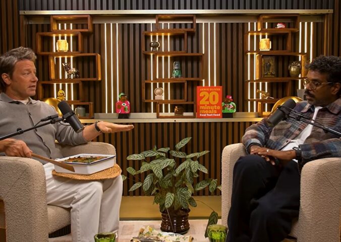 Photo shows Jamie Oliver speaking to Romesh Ranganathan on a recent episode of his podcast, and the celebrity chef brought the comedian a vegan lasagna