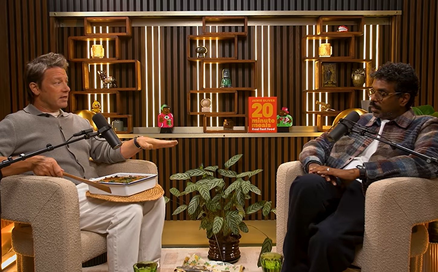 Photo shows Jamie Oliver speaking to Romesh Ranganathan on a recent episode of his podcast, and the celebrity chef brought the comedian a vegan lasagna