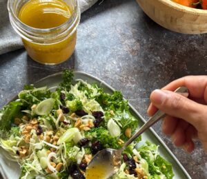 mandarin vinaigrette with olive oil, mandarin juice, apple cider vinegar, English mustard, maple syrup, garlic, and more